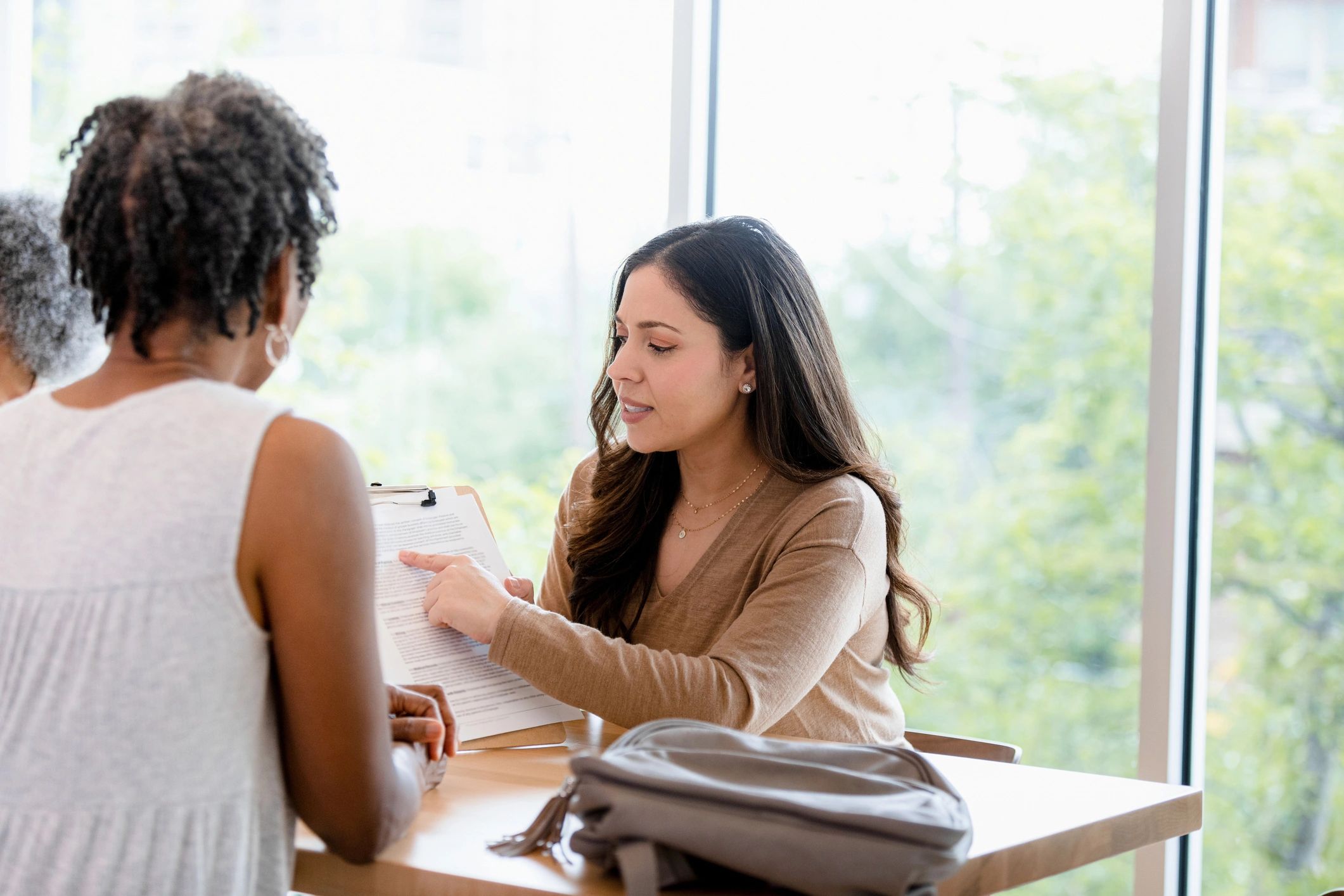 Consultant reviewing paperwork with a client