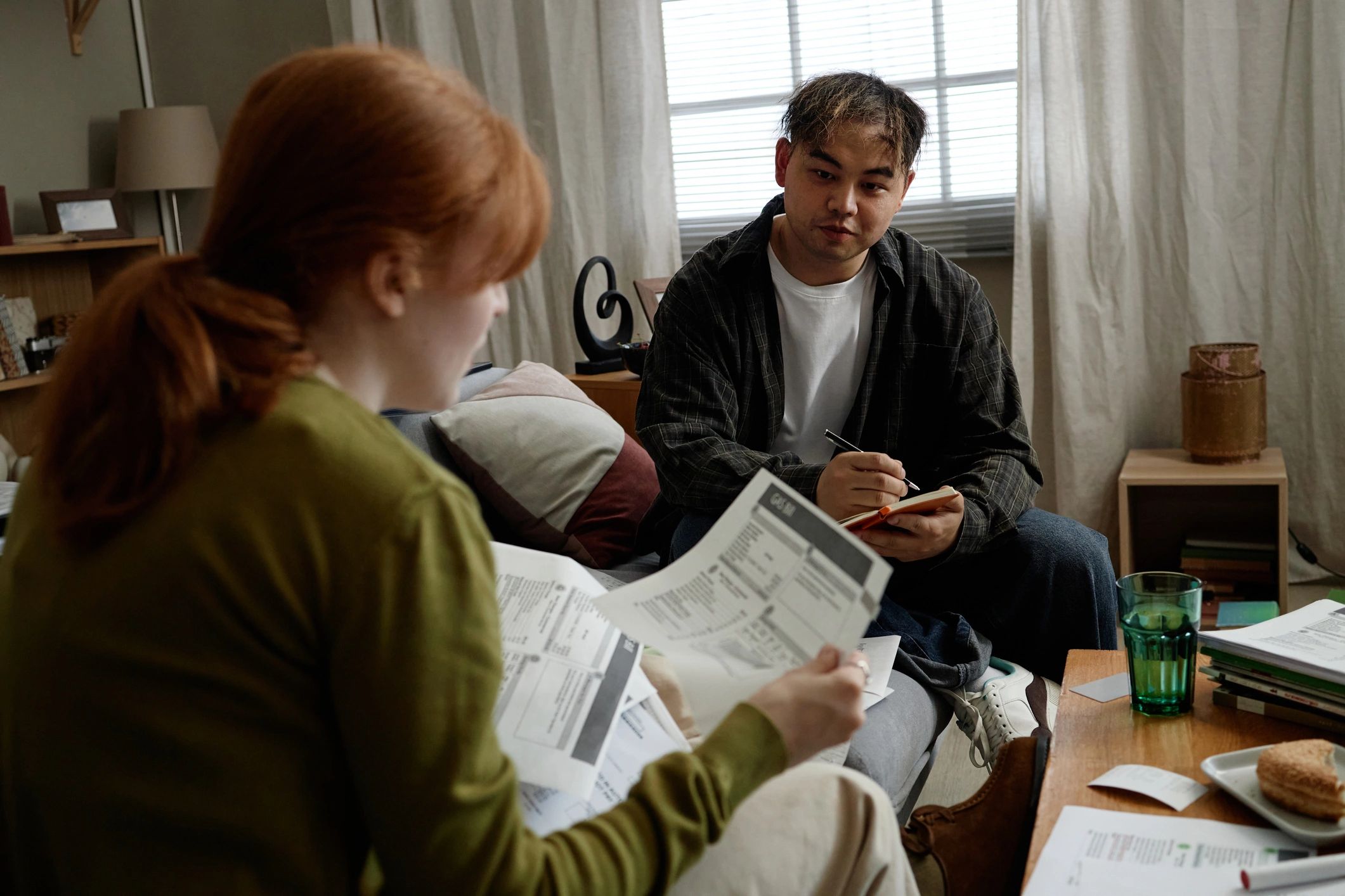 Advisor reviewing household bills with a client